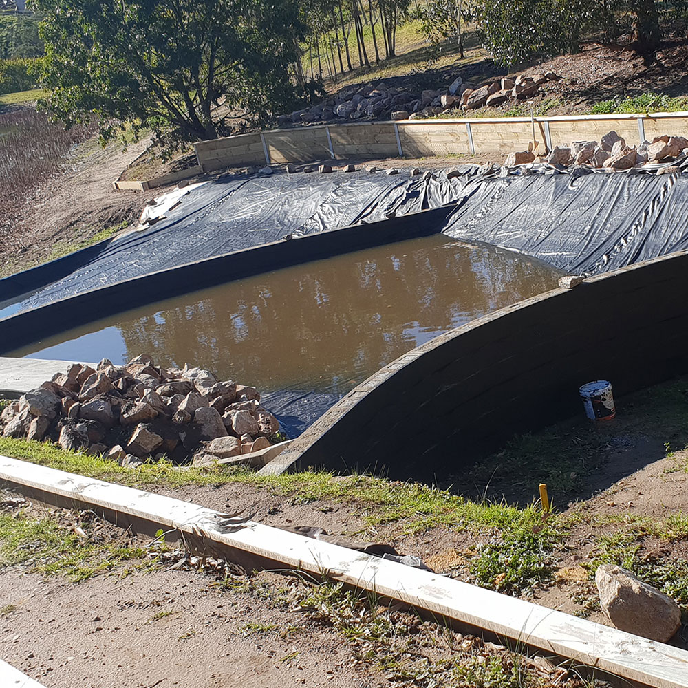 AD BUILD dam construction.